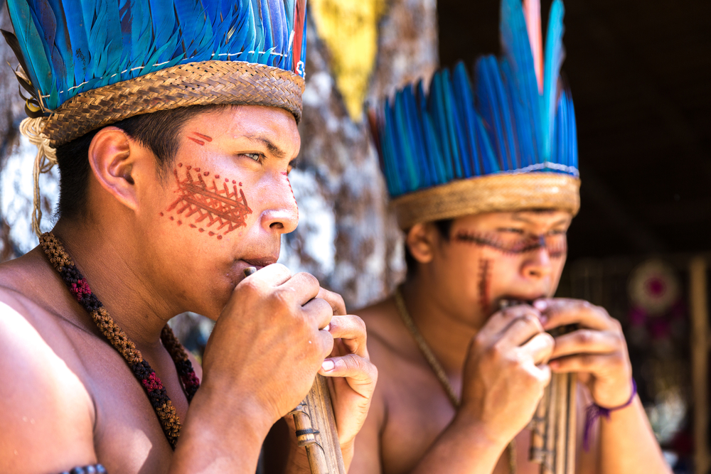 Native Americans in the Amazon in their traditional dress. 