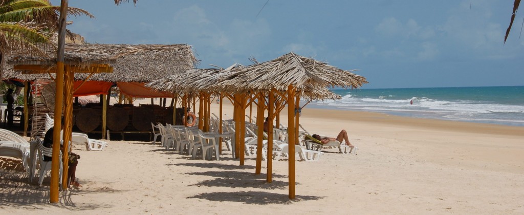 A beach with plenty of sun-loungers on the Brazilian Northeast coast. 