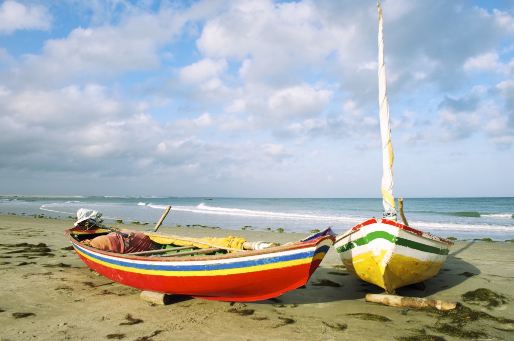 Two brightly painted Jangads on a Nordeste beach. 