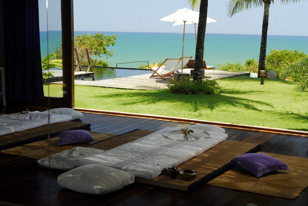 A sunny day at Txai Itacaré resort, view of a calm and blue sea. 