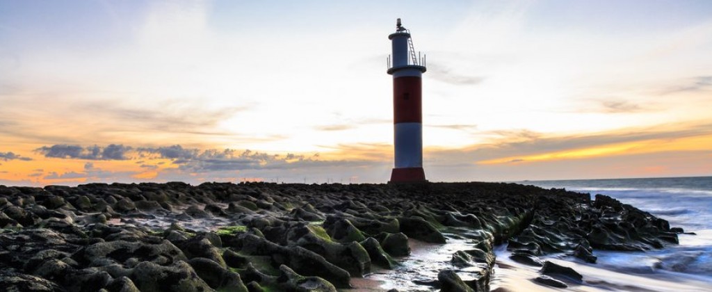 An exquisite view of the sea and the lighthouse in the sunset at Galinhos. 