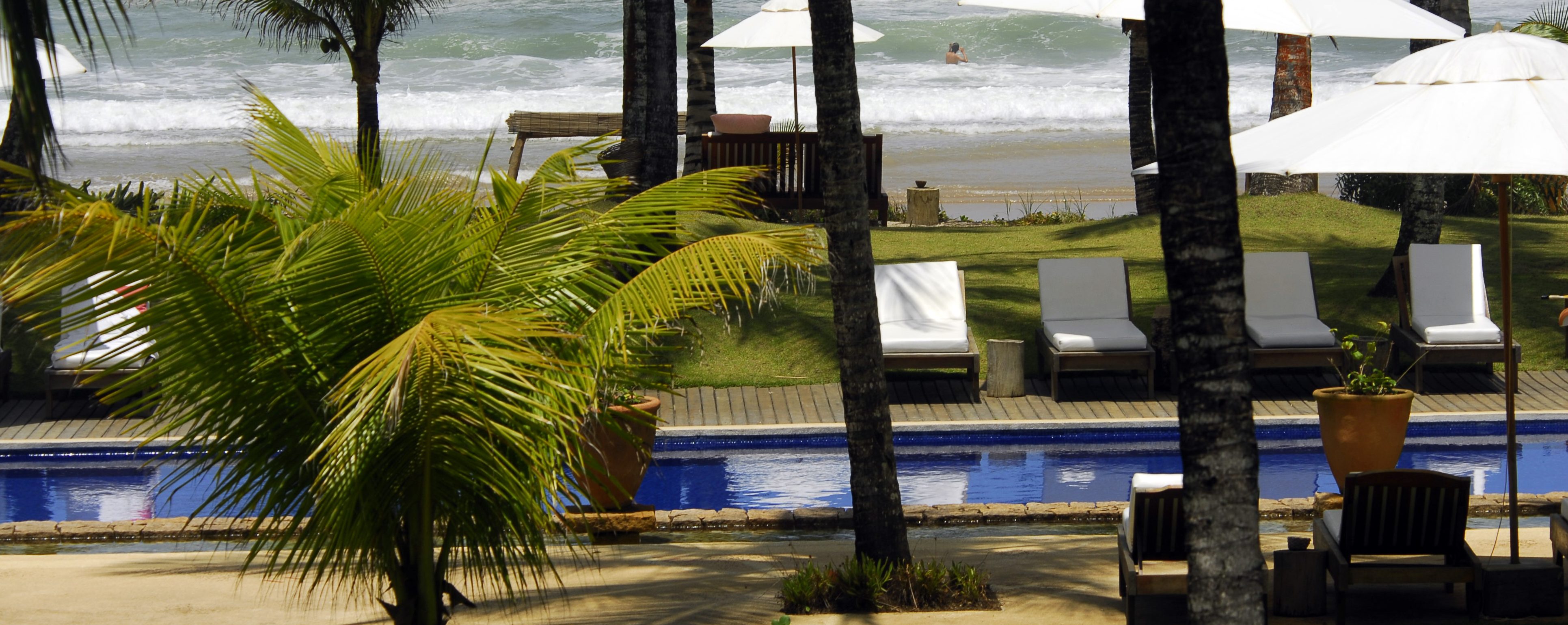 View of the beach from the pool at Txai resort Itacaré. 