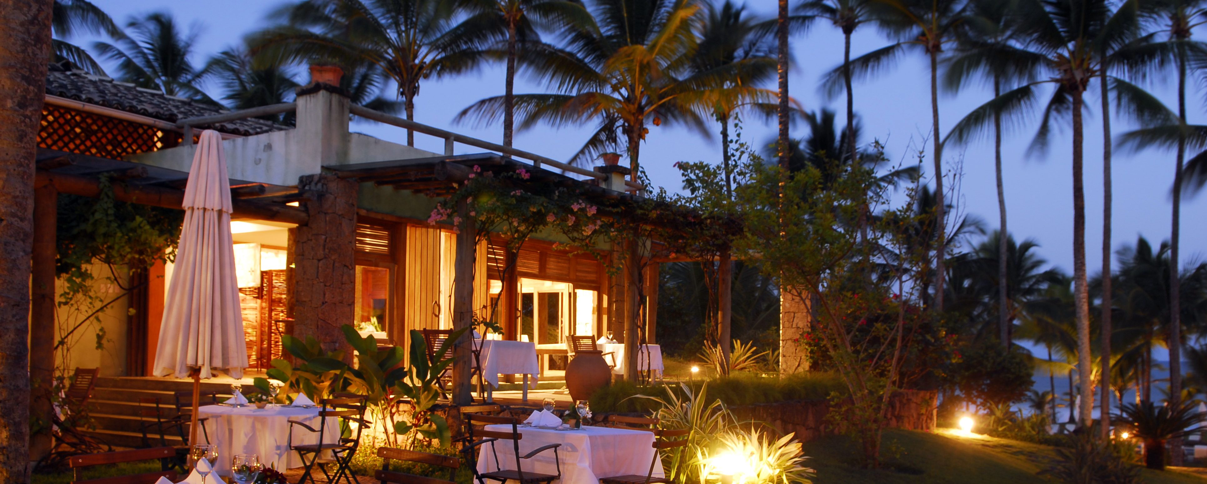 The beautifully lit Txai Itacaré restaurant after dark. 