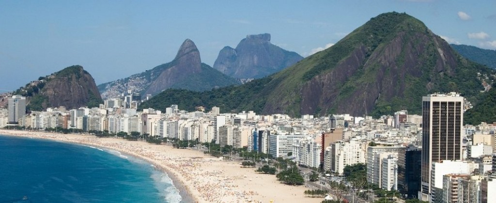 Mountains behind the buildings that line Copacabana in Rio de Janeiro. 
