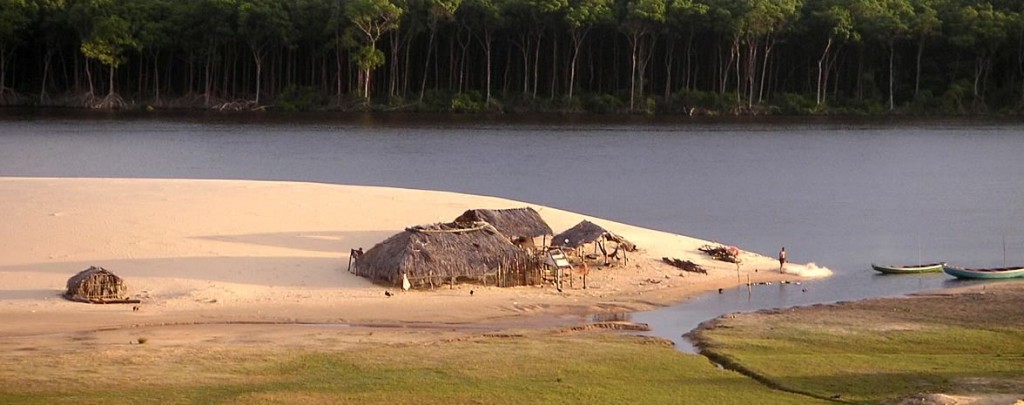 Small local huts on he edge of a lake in Northeast Brazil.
