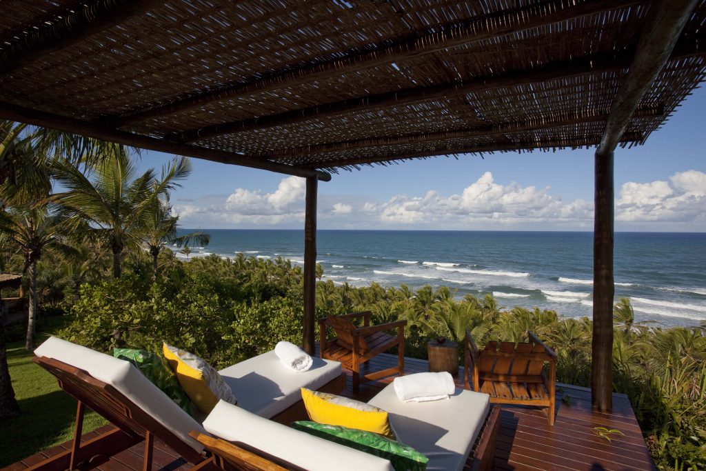 Sunbeds looking out onto the sea at the Txai Itacaré resort. 