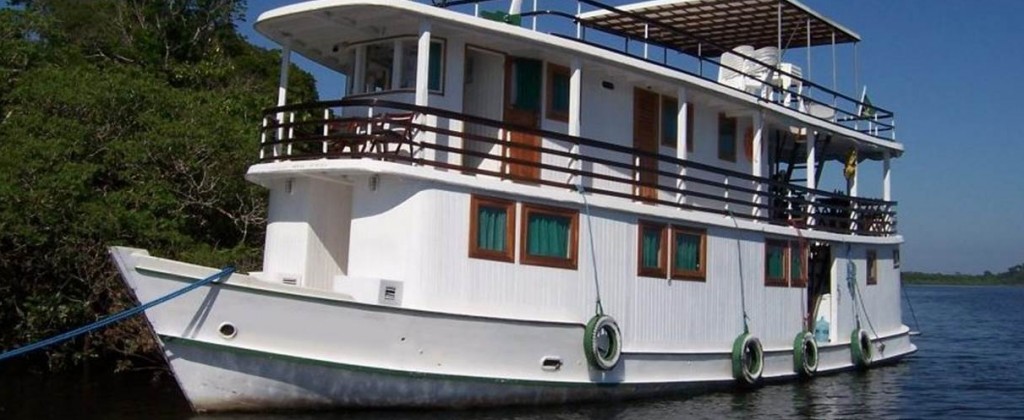 A private Amazon boat docked up at a Mangrove. 