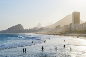 Rio de Janeiro beach, with the city and mountains in the background. 