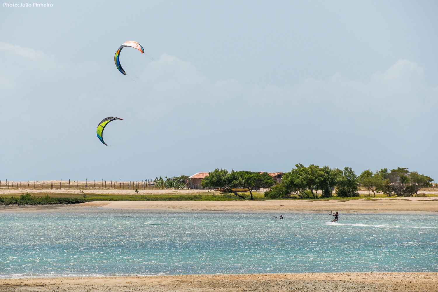 Kitesurfing across a abeautiful lagoon. 