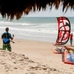 Man learning to control his kite on the beach.