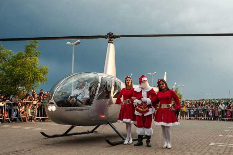 Santa arriving by helicopter for Christmas in Brazil